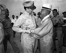 General Douglas MacArthur and Syngman Rhee, Korea's first President, warmly greet one another upon the General's arrival at Kimpo Air Force Base alt text