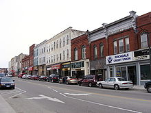 cars parked in front of stores