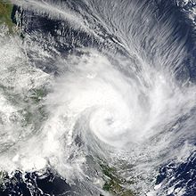 View of Cyclone Elita from Space on January 28, 2004. The eye of the storm, visible near the center of the image, is making landfall on Madagascar.