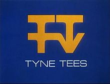 An arrangement of the letters TTTV in yellow on a blue background.