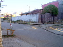 an empty street in a residential neighborhood