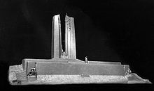 A white plaster design model of the Vimy Memorial from the front side, displayed against a black background.