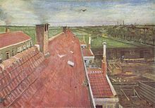 A view from a window of pale red rooftops. A bird flying in the blue sky and in the near distance fields and to the right, the town and others buildings can be seen. In the distant horizon are smokestacks