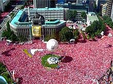  Sea of supporters in Seoul during the 2002 FIFA World Cup text