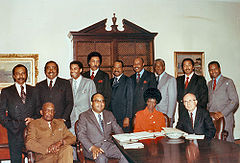 Rangel and twelve other African-American members of Congress posed around a table