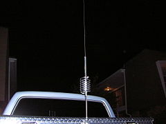 CB antenna with loading coil, mounted on pickup-truck metal tool box