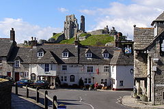 The castle rises above the village square