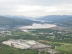 Aerial view west across Inverlochy showing Inverlochy aluminium works, Corpach and Loch Eil
