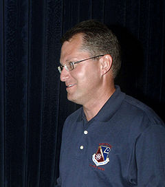 Profile view of Author Dave Pelzer, facing left