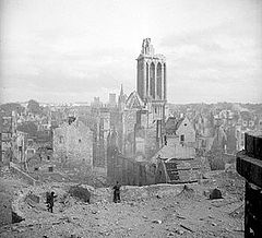 A scenic cityscape showing destroyed and badly-damaged buildings