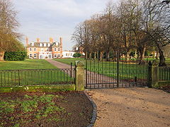View of the hall and drive from outside the iron gates