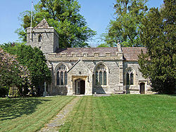 Stone building with small square tower.