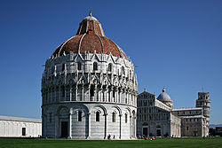 The Piazza dei Miracoli. The Baptistery is in the foreground, the Duomo is in the center, and the leaning tower in the background on the right.