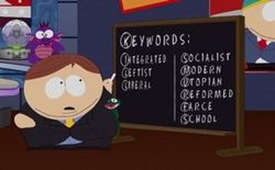 A male, fourth-grade animated character stands by a chalkboard on which he has written "Keywords: Integrated, Leftist, Liberal" in the left-hand column, and "Socialist, Modern, Utopian, Reformed, Farce, School" in the right-hand column, and has circled the first letter of each word to form the acronym "KILL SMURFS"