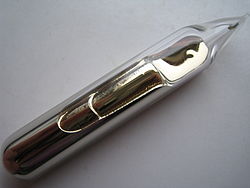 Some silvery-gold metal, with a liquid-like texture and lustre, sealed in a glass ampoule