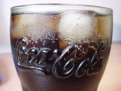 Coca Cola in its signature logo glass