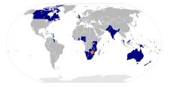 The Commonwealth (blue = present members, orange = former members, green = suspended members, light blue = dependent territories of members)