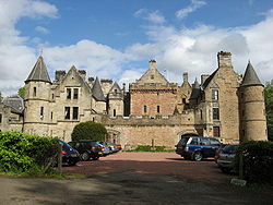Dalzell House: the tower house is in the centre, with the 17th-century south range on the right, and the 19th-century north range on the left