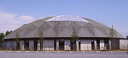 The structure has a round roof with a large skylight.