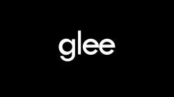 A black background with the word "Glee" written in white lowercase letters and centered.