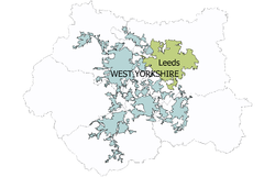 A map of West Yorkshire showing the Leeds urban subdivision of the West Yorkshire Urban Area coloured green and the rest of the Urban area coloured blue-grey
