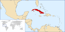 Political map of the Caribbean region with Cuba in red. An inset shows a world map with the main map's edges outlined.