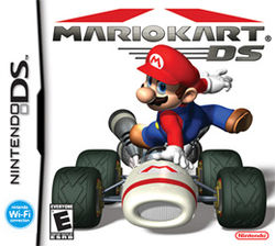 Video game box art. A video game character, Mario, leaps over a racing kart.