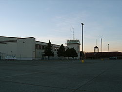 A picture from the Mt. Edgecumbe High School parking lot of the BJ McGillis Fieldhouse and the Academic Building.