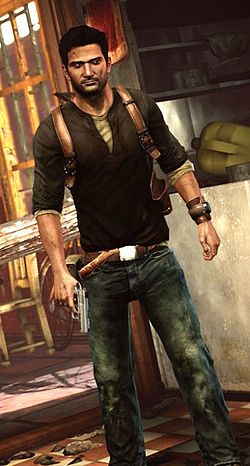 A video game screenshot of a young man standing resolutely and holding a gun by his right side. He is wearing a dark shirt, unbuttoned slightly so that a white shirt is seen underneath, blue jeans, and a brown belt with a silver buckle. He has leather straps around his shoulders and a leather band around his left arm. His hair is black, he has a slight beard. Behind him is a well-lit room with some indistinct appliances and scattered items, as well as a chair and a large window letting in light.