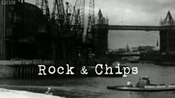 The text "Rock & Chips" in a fixed-width, typewriter-style white font overlaid on a black-and-white construction scene beside the River Thames