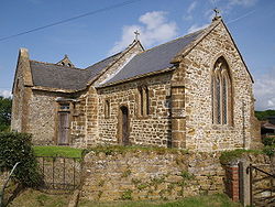 Stone building with tiled roof.