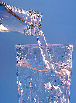 A glass of mineral water being poured