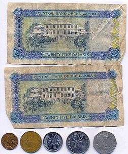 25 dalasi note and coins from 5 bututs to 1 dalasi