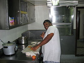A chief cook at work in the ship's galley.