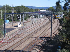 Looking south over Morisset rail yard,with the station in the distance and maintenance trains on a siding