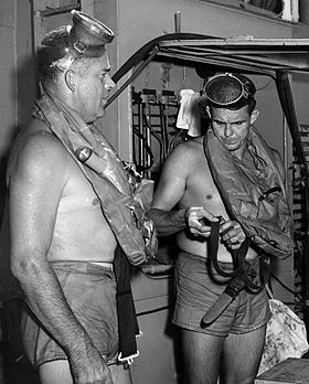 This is a photo of Commander George F. Bond and Chief Engineman Cyril Tuckfield after safely completing a 302 foot buoyant ascent in 52 SECONDS from the forward escape trunk of the USS Archerfish bottomed at 322 feet