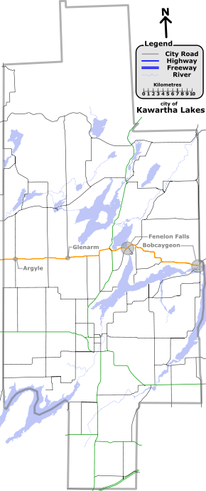 "A map with various coloured lines representing different types of roadways. In deep-blue are provincial highways. In black are other Kawartha Lakes numbered roads. In orange is Kawartha Lakes Road 8. Lakes and rivers are light-blue."