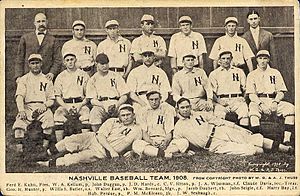 In this photograph of a baseball team, seventeen men are situated in three rows facing the camera, with three sitting on the ground, seven sitting in chairs, and seven standing.