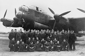 Some of No. 460 Squadron RAAF's ground crew posing in front of the bomber G for George in May 1944