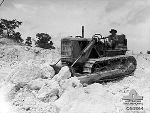 A No. 5 Airfield Construction Squadron bulldozer working in a coral quarry at Noemfoor Island during December 1944