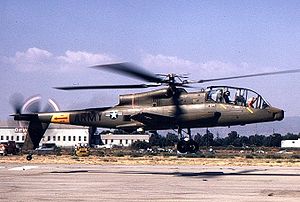 A side view of an AH-56 Cheyenne in hover, a few feet above runway.