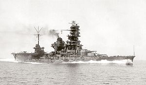Black and white photograph of a World War II-era warship.