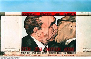 Soviet premier Leonid Brezhnev locked in a mouth-to-mouth kiss with East German leader Erich Honecker above the legend My God, Help Me to Survive This Deadly Love