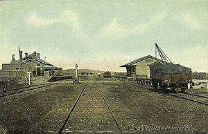 The station circa 1910, with three tracks running between passenger and goods shed platforms.