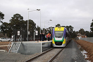 VLocity train stopped at Creswick,the original station building and platform in the background