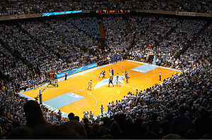 View of Dean Dome from the stands during a tip-off of a 2006 basketball game between Duke University basketball players and North Carolina basketball players