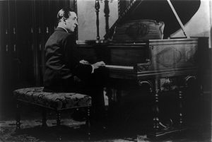 Vladimir Horowitz seated at the piano.