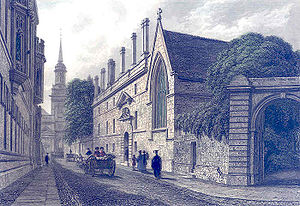 A three-storey building with regularly positioned windows, chimneys and an elaborated decorated entrance, adjoining a building with a large Gothic window, with a street in front on which there are people walking, and horses and carriages. There is a church spire in the distance.