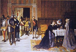 A woman rests her head in her hand while sitting at a table; a knight in armor and others stand by having told her the bad news.