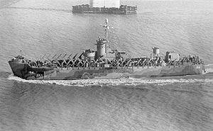 USS LSM(R)-194, of the LSM(R)-188 Class, passing under the Cooper River Bridge, Charleston, SC, 2 December 1944.